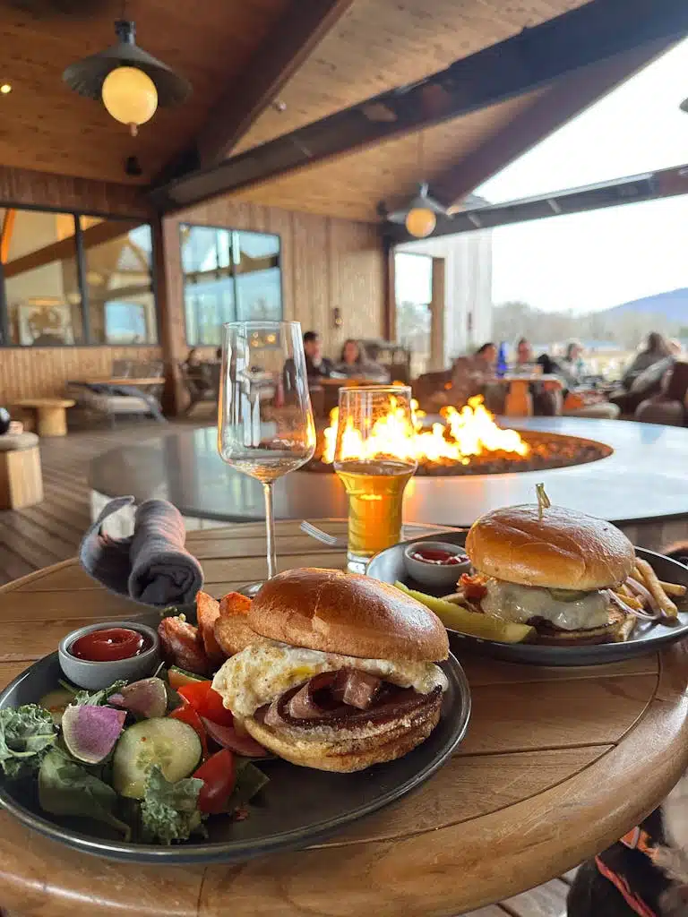 Burgers and drinks by a cozy fire pit at a Hudson, NY restaurant.